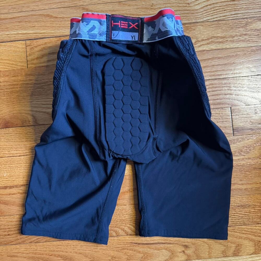 Youth large mcdavid padded shorts football, baseball, basketball equipment